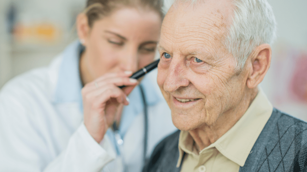 An old patient undergoing ear micro suction at Omnicare Pharmacy