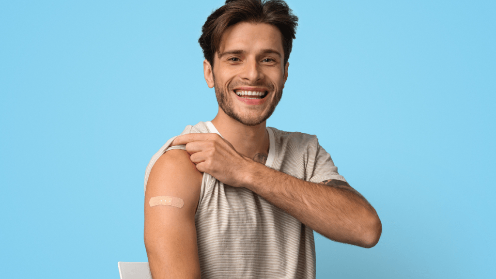 Patient with band-aid in a blue background
